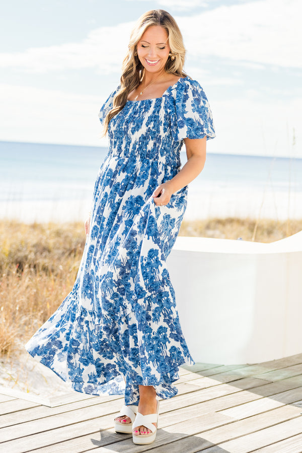 Chic Soul plus size clothing, short-puffed-sleeve blue maxi dress with ruffled detailing and a smocked bodice with a blue and white floral pattern