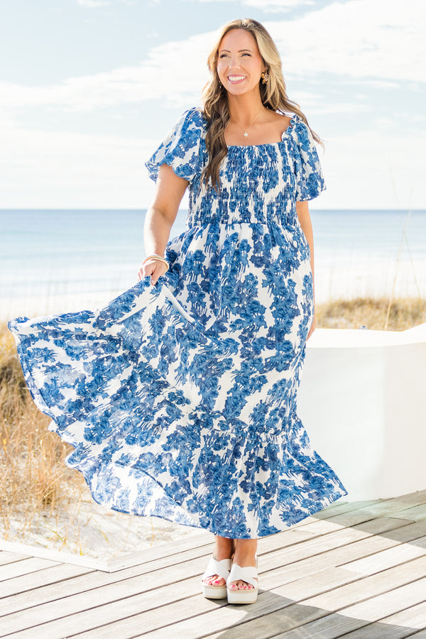 Chic Soul plus size clothing, short-puffed-sleeve blue maxi dress with ruffled detailing and a smocked bodice with a blue and white floral pattern