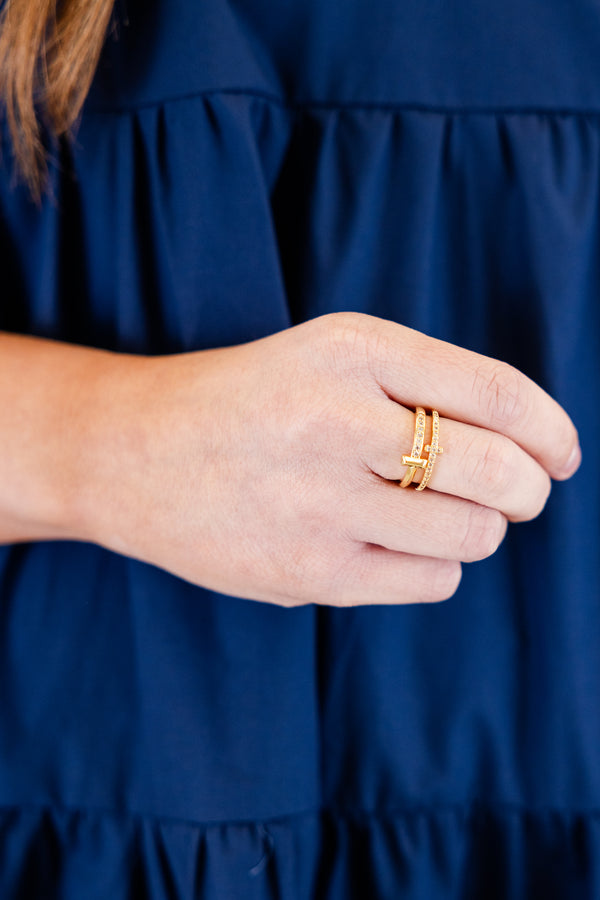 Chic Soul plus size clothing, gold double-band ring with an open design and one band is sleek while the other is covered in small gemstones and a cross connecting the two bands at the center 