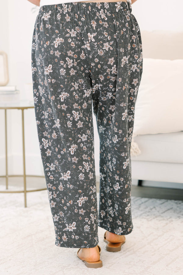 Plus Size black floral corduroy pants with a wide leg fit and drawstring waist.