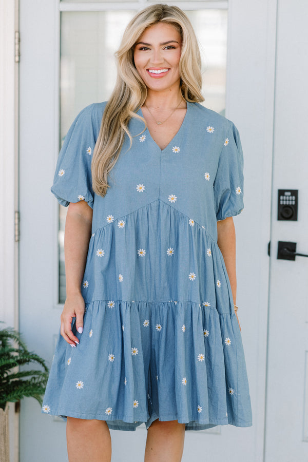 Chic Soul plus size clothing, short-puffed-sleeve denim blue ruffled baby doll top with a v-neckline and a subtle white daisy pattern 