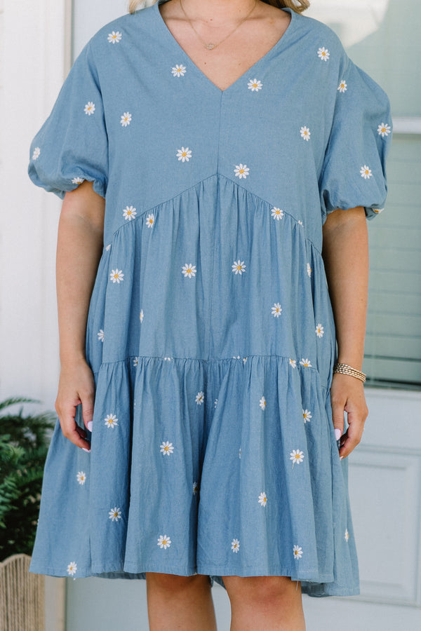 Chic Soul plus size clothing, short-puffed-sleeve denim blue ruffled baby doll top with a v-neckline and a subtle white daisy pattern 