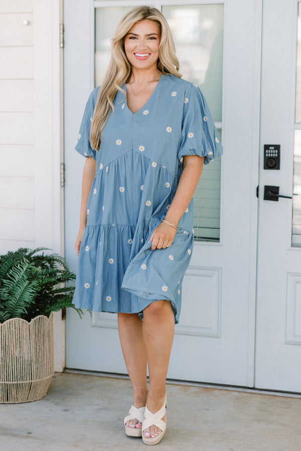 Chic Soul plus size clothing, short-puffed-sleeve denim blue ruffled baby doll top with a v-neckline and a subtle white daisy pattern 