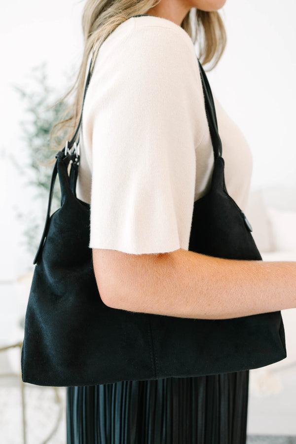 Plus Size black suede shoulder bag with adjustable straps and a spacious, slouchy silhouette.
