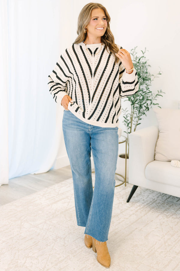 Plus Size cream and black chevron striped pointelle knit sweater with long sleeves and crew neck.