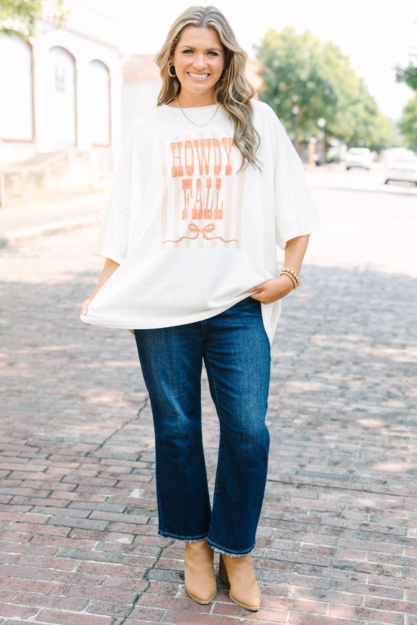 Plus Size ivory boyfriend tee with orange Howdy Fall graphic and blue denim jeans.