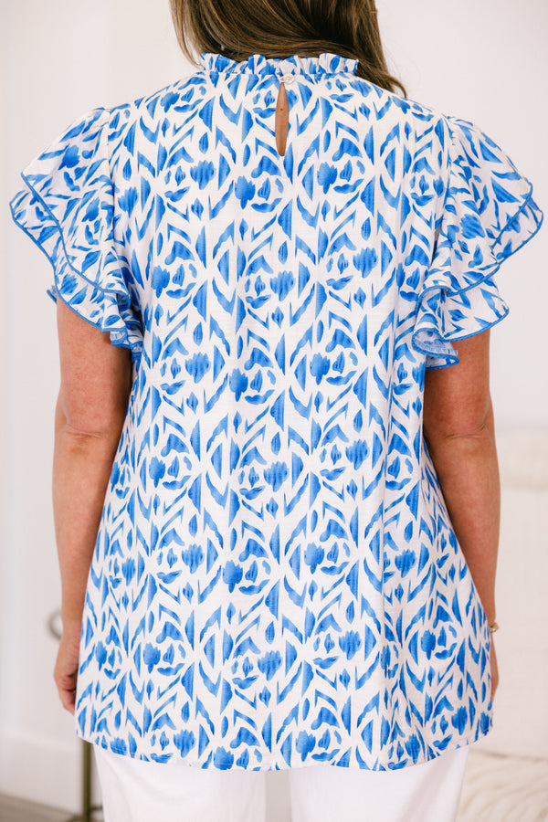 Plus Size blue and white abstract print top with flutter sleeves and a high neckline.