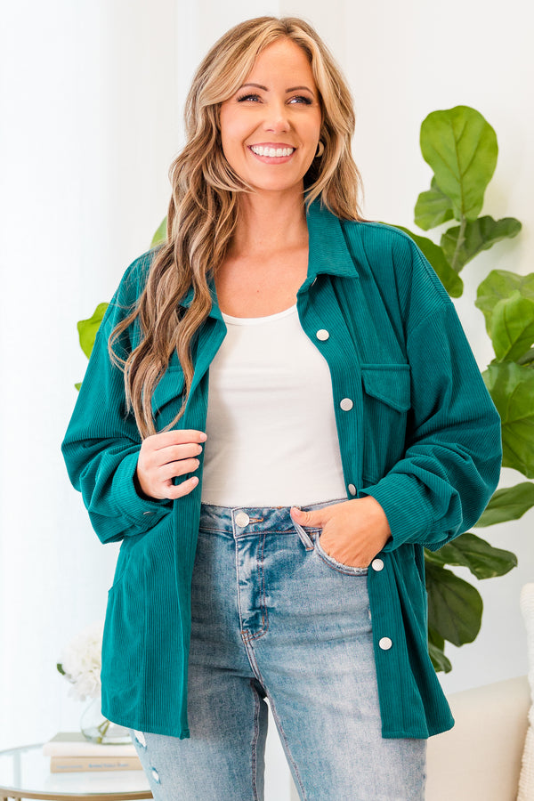 Plus Size teal corduroy button-down jacket with chest pockets over a white top and light wash jeans.