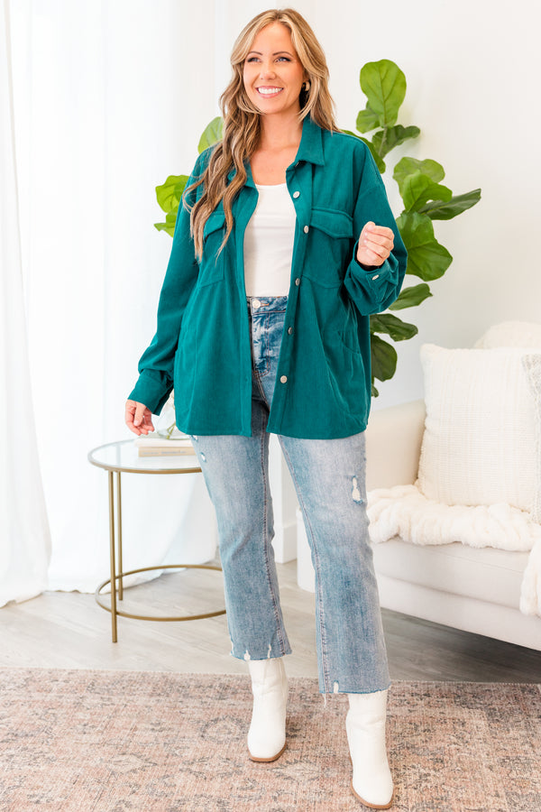Plus Size teal corduroy button-down jacket with chest pockets over a white top and light wash jeans.