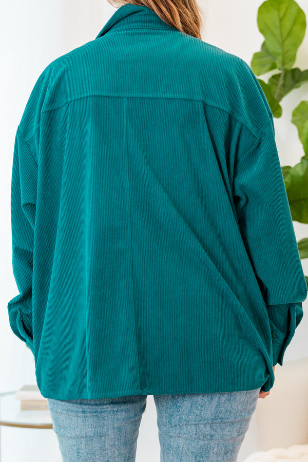 Plus Size teal corduroy button-down jacket with chest pockets over a white top and light wash jeans.