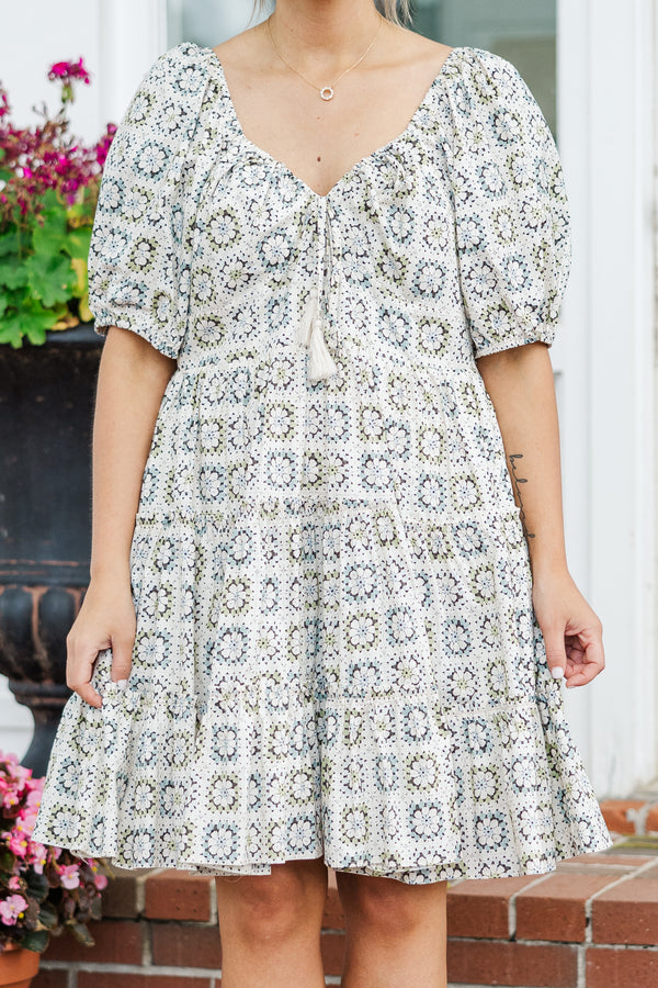 Chic Soul plus size clothing, sage short sleeve mini dress with geometric pattern with puff sleeves and v neckline with tassel tie detail 