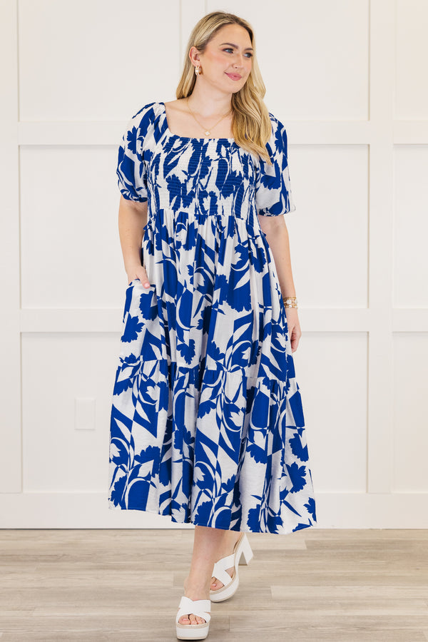Chic Soul plus size clothing, short-puffed-sleeve ruffled royal blue midi dress with a smocked bodice and a square-neckline with an abstract floral blue and white pattern 