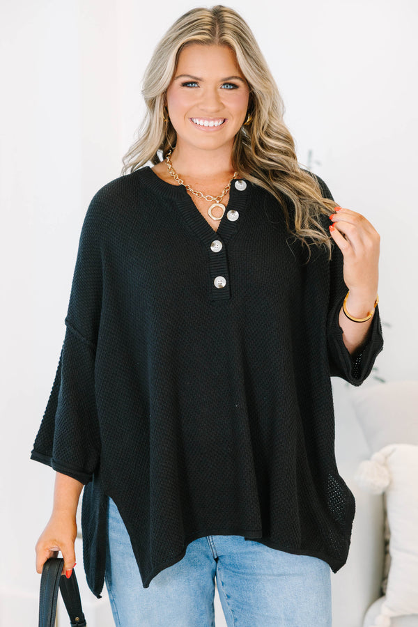 Plus Size black oversized knit top with a button-up henley neckline and three-quarter sleeves.