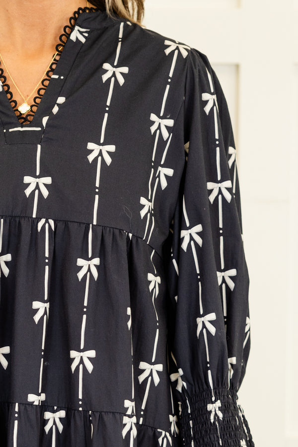 Chic Soul plus size clothing, long-sleeve black ruffled baby doll dress with a v-neckline and scalloped detailing along neckline with a pinstripe white bow pattern