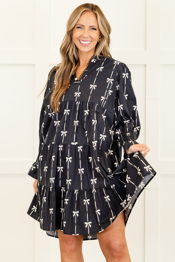 Chic Soul plus size clothing, long-sleeve black ruffled baby doll dress with a v-neckline and scalloped detailing along neckline with a pinstripe white bow pattern