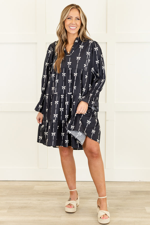 Chic Soul plus size clothing, long-sleeve black ruffled baby doll dress with a v-neckline and scalloped detailing along neckline with a pinstripe white bow pattern