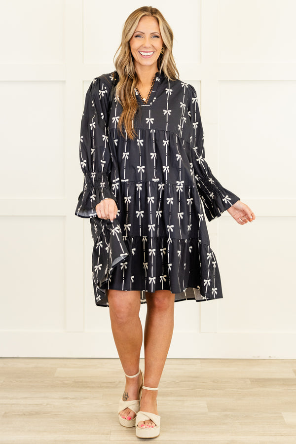 Chic Soul plus size clothing, long-sleeve black ruffled baby doll dress with a v-neckline and scalloped detailing along neckline with a pinstripe white bow pattern