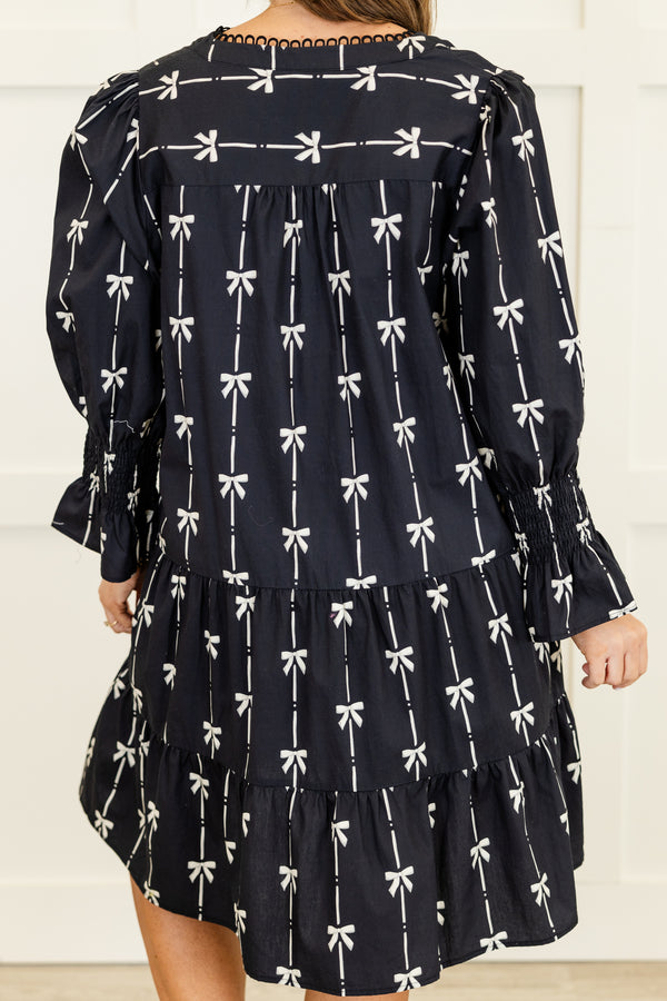 Chic Soul plus size clothing, long-sleeve black ruffled baby doll dress with a v-neckline and scalloped detailing along neckline with a pinstripe white bow pattern