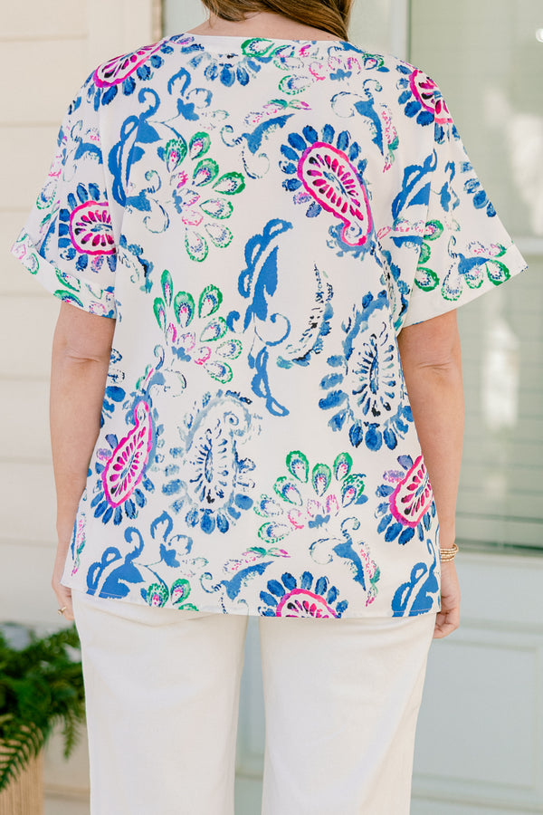 Plus Size short sleeve split v-neck top with a vibrant blue and pink abstract paisley print.