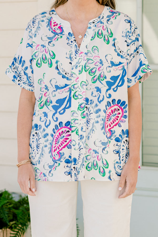 Plus Size short sleeve split v-neck top with a vibrant blue and pink abstract paisley print.