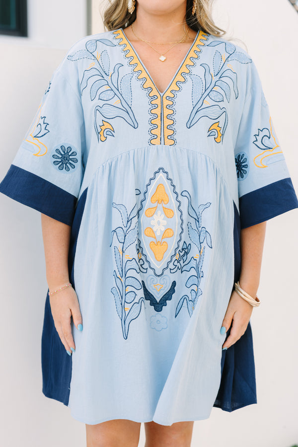 Chic Soul plus size clothing, light blue v neck tunic dress with orange and navy embroidery detailing and navy blocking on the edge of the sleeve and sides of the dress