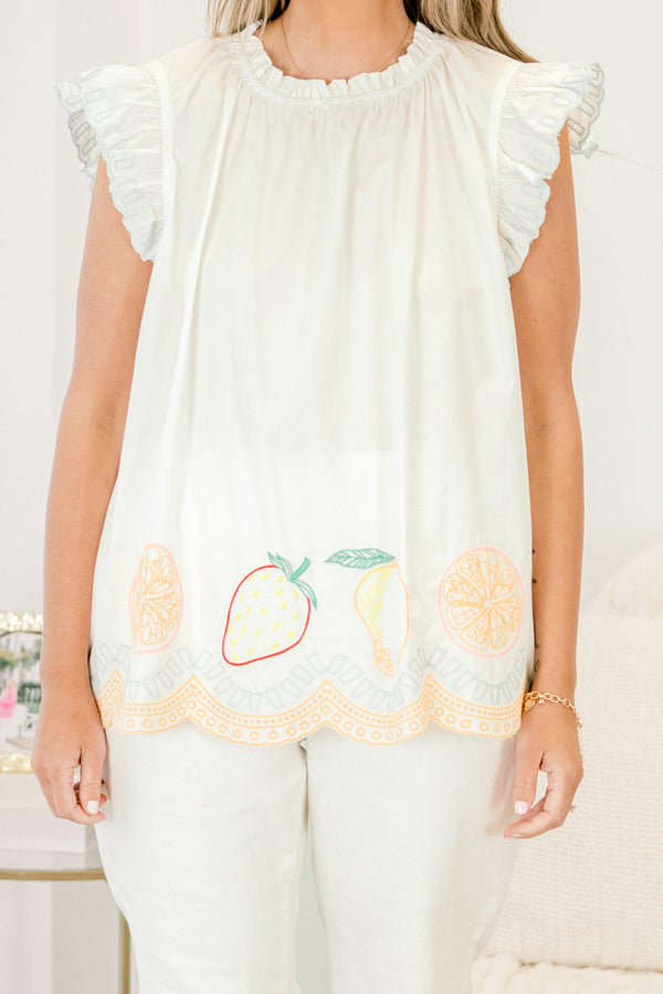 Chic Soul plus size clothing, white top with flutter sleeves and stitching details or fruit and various patterns along the bottom of the top 