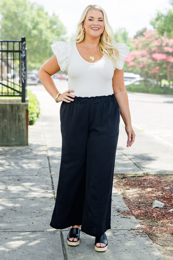 Chic Soul plus size clothing, black flowy pants with ruched stretchy waist and pockets plus small slit along calf