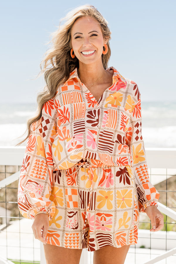 Chic Soul plus size clothing, collared buttoned long-sleeve orange multi-colored flowy top with a geometric floral pattern 