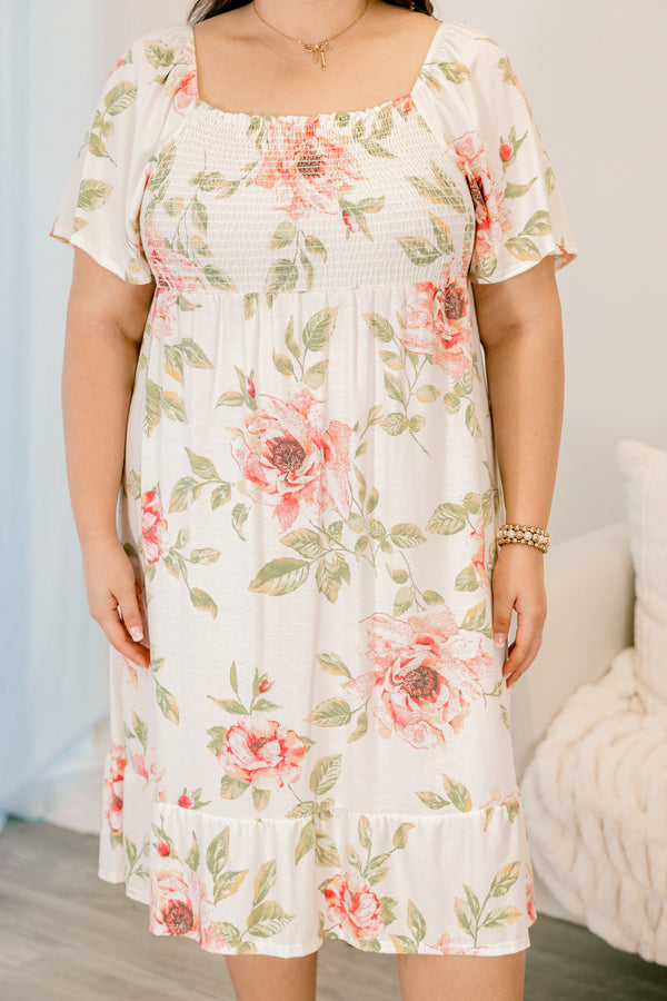 Plus Size ivory floral dress with a smocked bust, square neckline, and short sleeves.