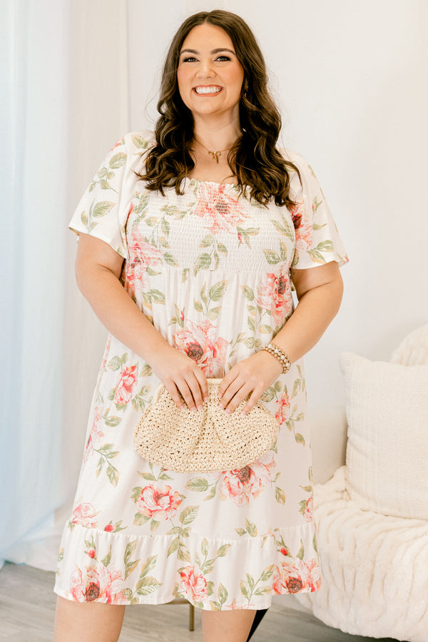 Plus Size ivory floral dress with a smocked bust, square neckline, and short sleeves.