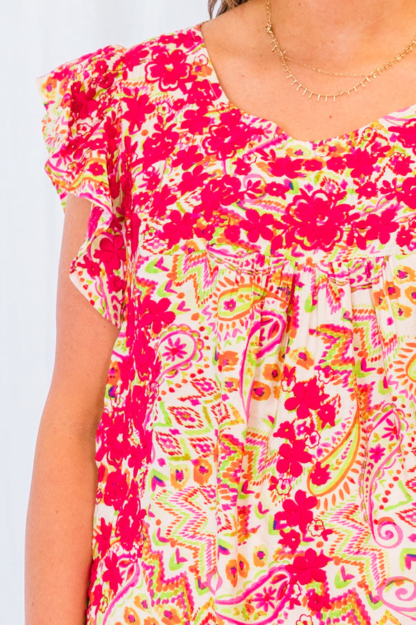 Plus Size ivory multi-patterned top with pink floral embroidery and ruffled cap sleeves.
