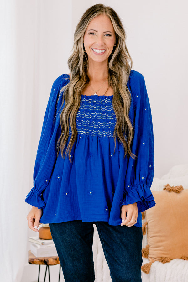 Chic Soul plus size clothing, blue long sleeve top with a square neckline that has white stitching details and white and blue embroidered floral accents throughout 