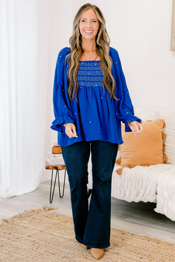 Chic Soul plus size clothing, blue long sleeve top with a square neckline that has white stitching details and white and blue embroidered floral accents throughout 