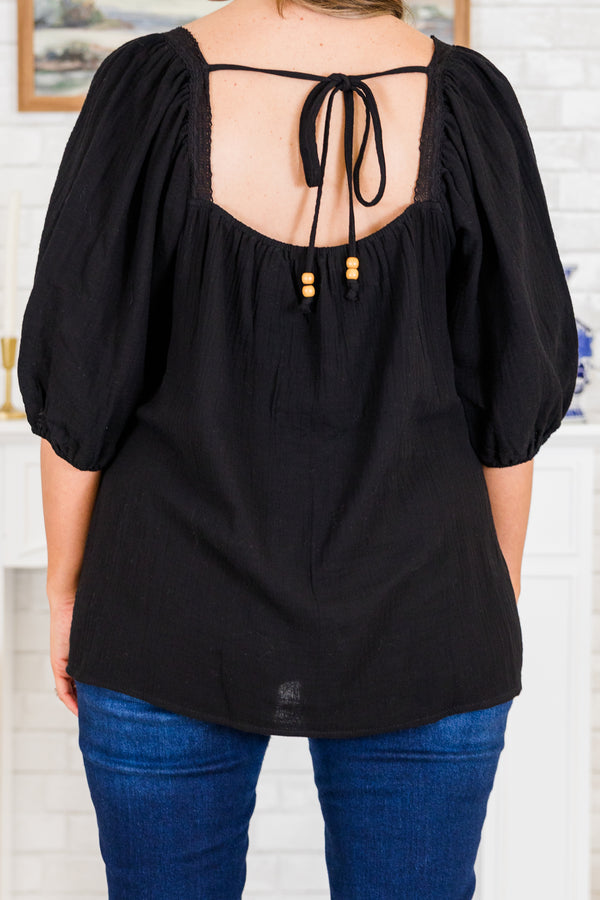Chic Soul plus size clothing, short-puffed-sleeve black top with white and black knit granny squares along the square neckline and tie on the back of the top