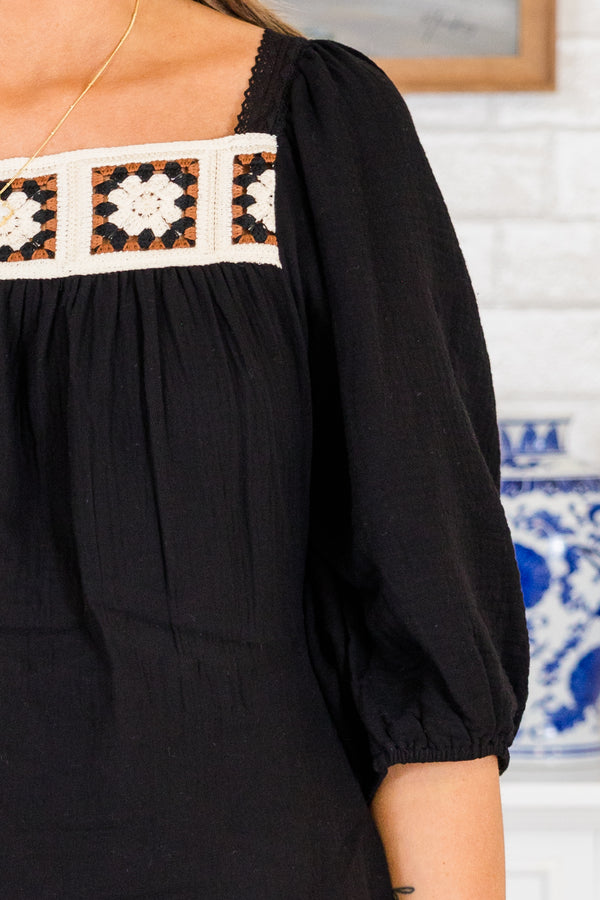 Chic Soul plus size clothing, short-puffed-sleeve black top with white and black knit granny squares along the square neckline and tie on the back of the top