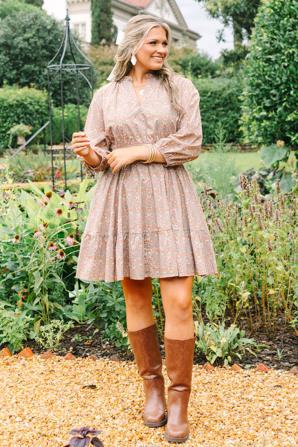Plus Size brown floral cotton dress with a smocked waist, V-neckline, and three-quarter sleeves.