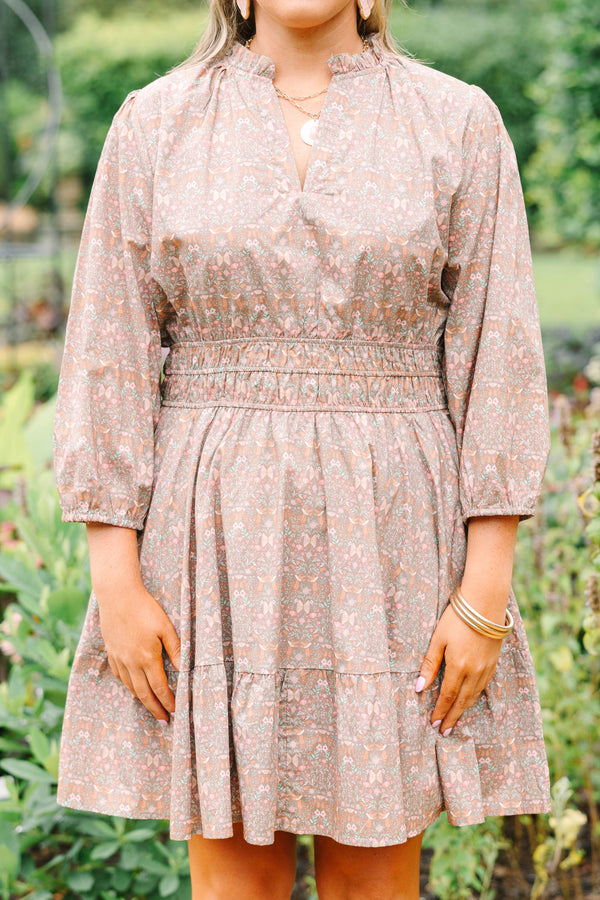 Plus Size brown floral cotton dress with a smocked waist, V-neckline, and three-quarter sleeves.