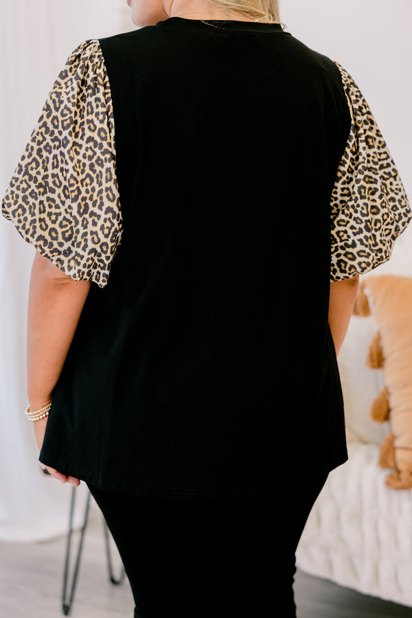 Chic soul plus size clothing, black top with bubble sleeves that have a leopard print on them 