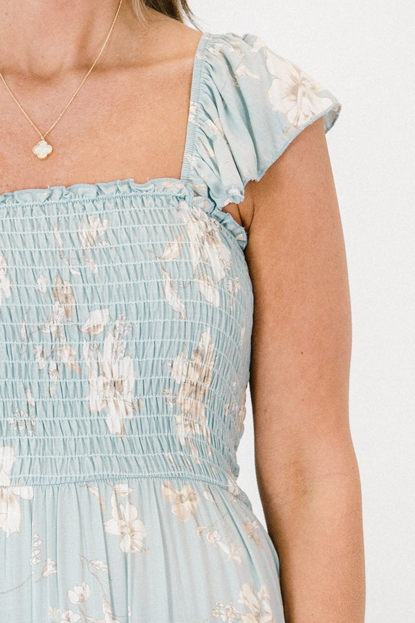 Chic Soul plus size clothing, light blue thick strap flowy ruffled maxi dress with a smocked bodice with a square-neckline and an ivory subtle floral pattern 