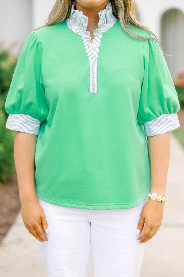 Plus size green top with blue and white striped contrast on neckline and sleeves