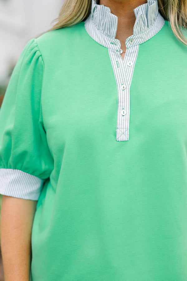 Plus size green top with blue and white striped contrast on neckline and sleeves