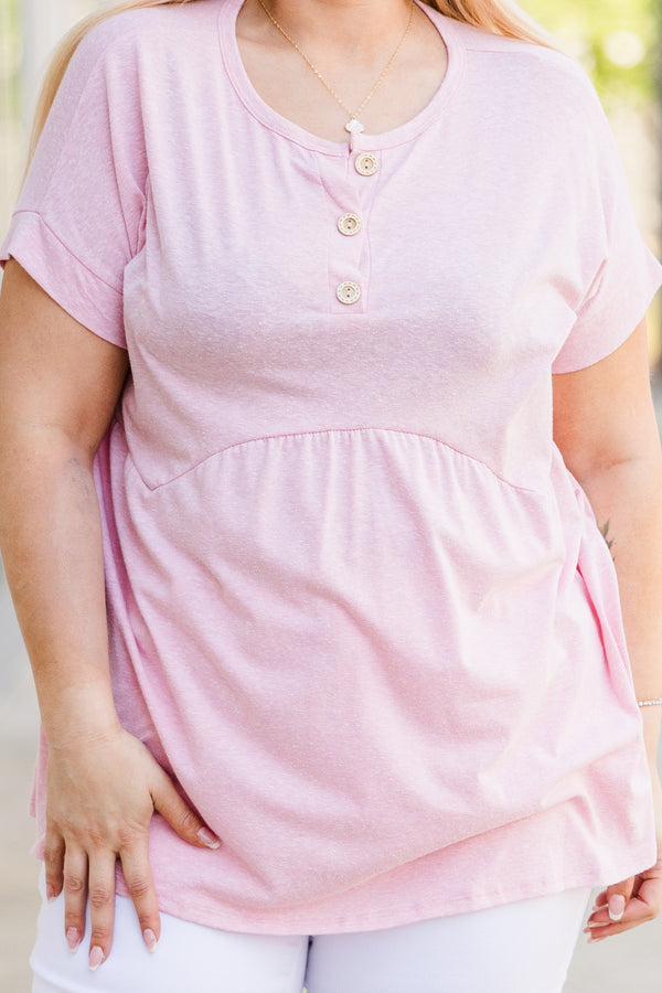 Plus Size blush pink short-sleeve babydoll top with a button-up neckline and relaxed fit.
