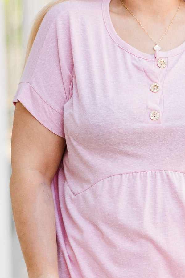 Plus Size blush pink short-sleeve babydoll top with a button-up neckline and relaxed fit.