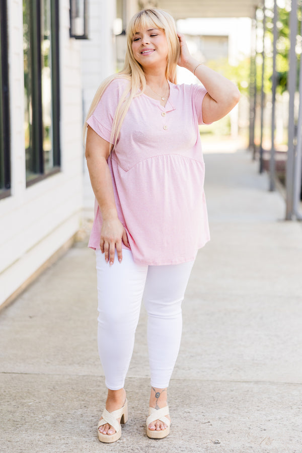 Plus Size blush pink short-sleeve babydoll top with a button-up neckline and relaxed fit.