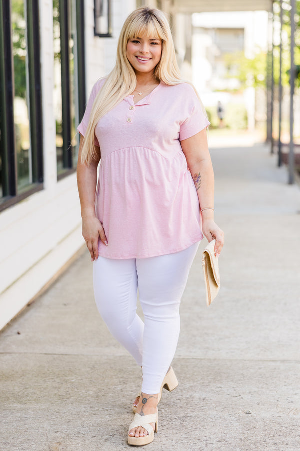 Plus Size blush pink short-sleeve babydoll top with a button-up neckline and relaxed fit.