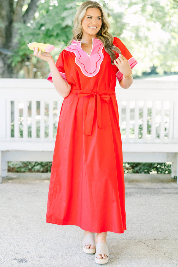 Plus Size red cotton midi dress with pink contrast trim, V-neckline, and adjustable waist belt.