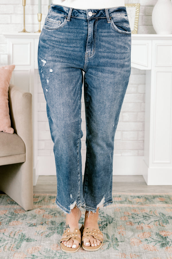 Chic Soul plus size clothing, medium wash denim jeans with distressed holes on the right pant leg and distressing and frayed hems