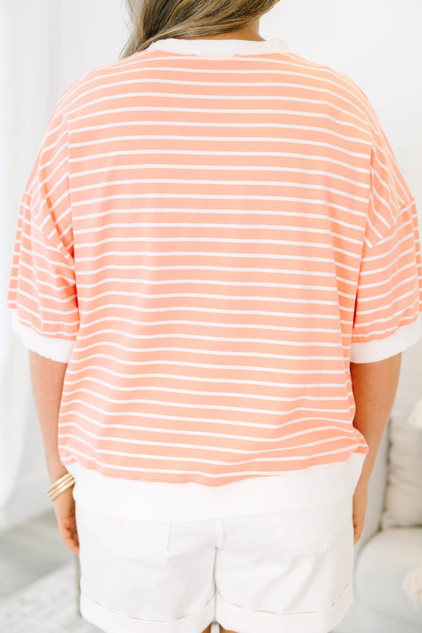 Plus Size coral and white striped short sleeve top with a crew neck and ribbed trim.