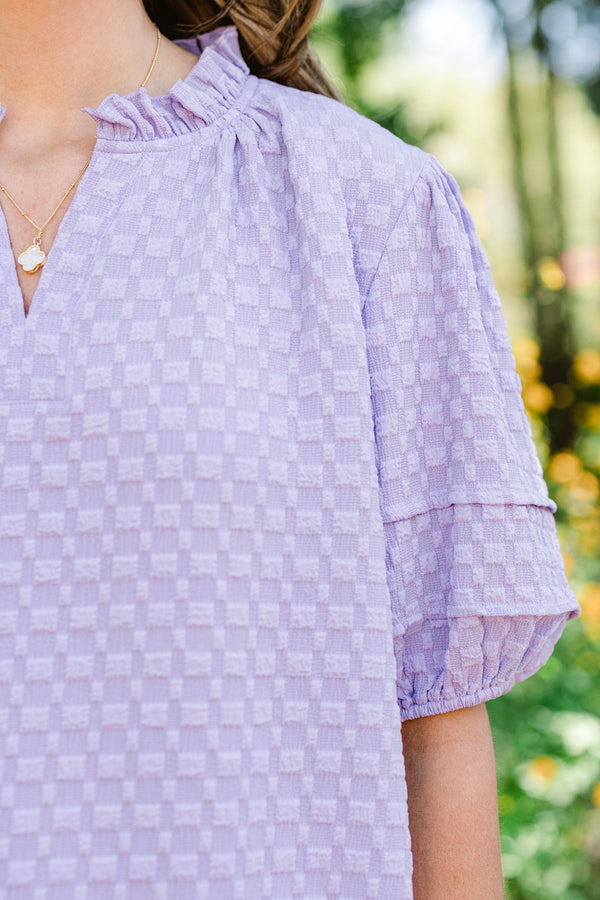 Chic Soul plus size clothing, short-puffed-sleeve light purple top with a textured spotted material and a split-v-neckline with ruffles along the neckline