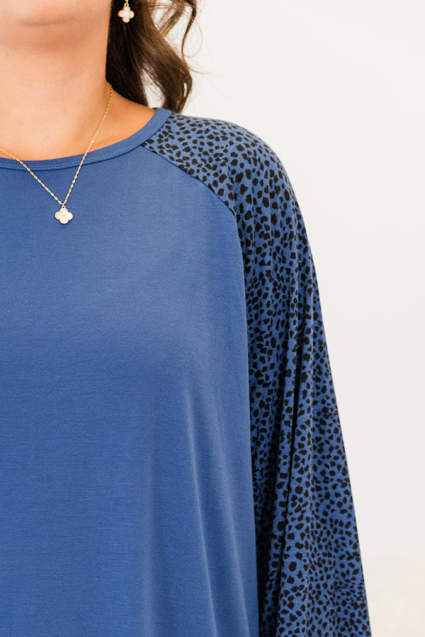 Chic Soul plus size clothing, blue long sleeve flowy top with round neckline with black dotted sleeves with cuff detail on sleeves